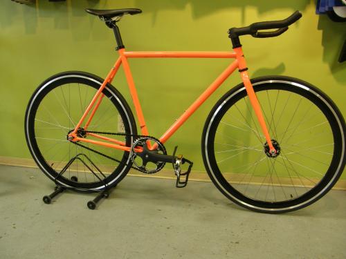 Orange fixie bike by Single Bike Co